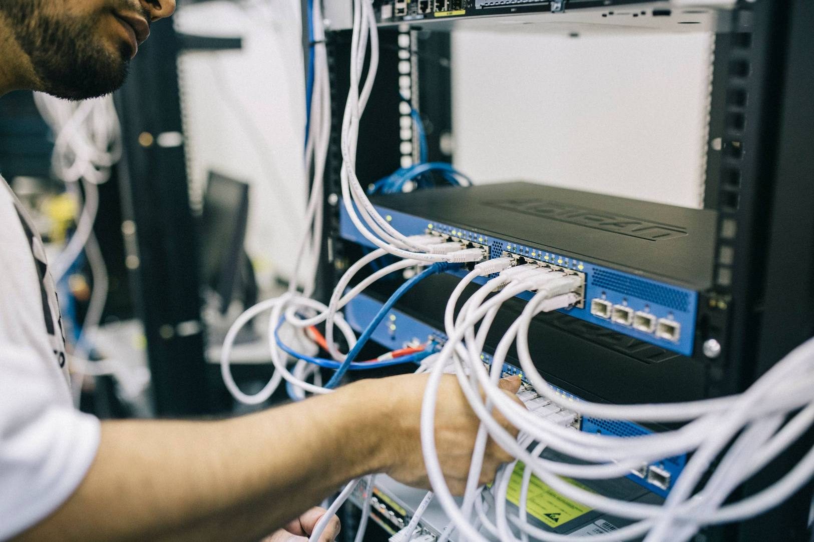Fiber and copper cabling organized on telecommunications racks